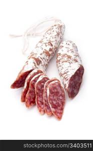 Sliced dry salami, isolated on white background