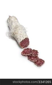 Sliced French Salami sausage on white background