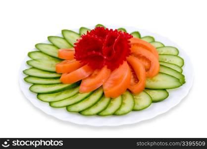 sliced fresh cucumbers and tomatoes with a beetroot flower on top, clipping path, isolated on white