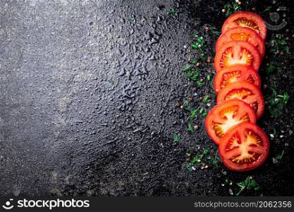 Sliced fresh tomatoes. On a black background. High quality photo. Sliced fresh tomatoes. On a black background.