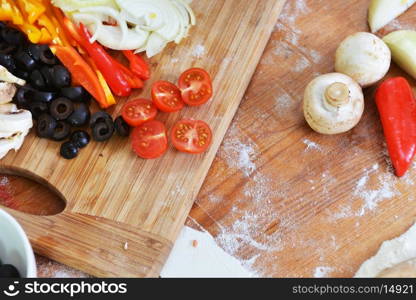 sliced ?? fresh vegetables on wooden background