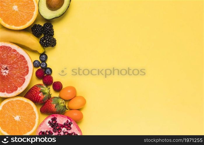 sliced fruits berries yellow background. High resolution photo. sliced fruits berries yellow background. High quality photo