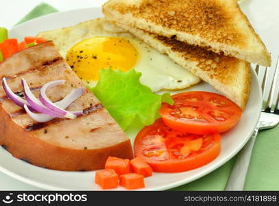 Sliced grilled ham with egg and vegetables