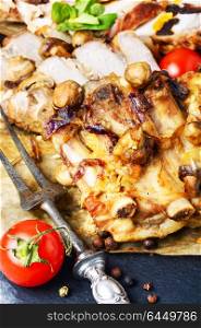 Sliced grilled pork barbecue. Piece of baked meat with mushrooms and spices.Delicious meat.Grilled meat