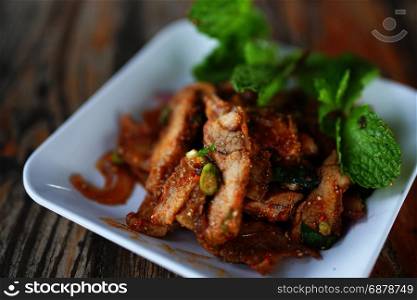 Sliced grilled pork salad, Moo nam tok Thai cuisine