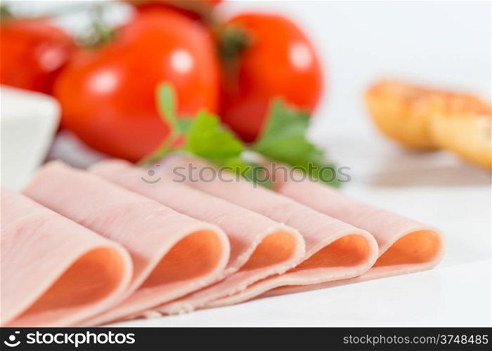 Sliced ham with bread and grated tomato