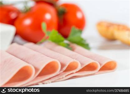 Sliced ham with bread and grated tomato