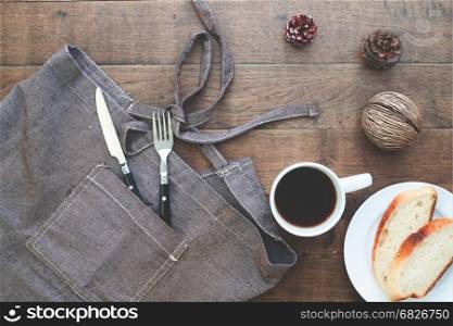 Sliced homemade bread with coffee on wood table with copy space