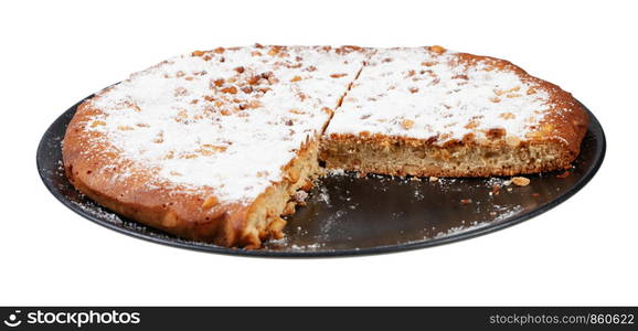 sliced Italian Pine Nut Cake on black plate isolated on white background