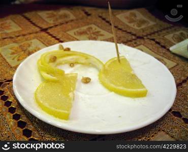 Sliced lemon on the plate