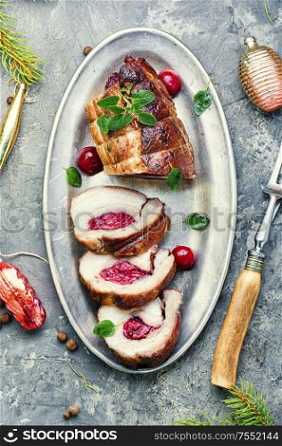 Sliced meatloaf filled with cherries.Christmas dish, festive food. Christmas meatloaf with cherry