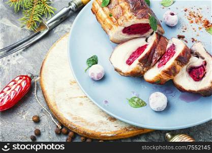 Sliced meatloaf filled with cherries.Christmas dish, festive food. Christmas meatloaf with cherry