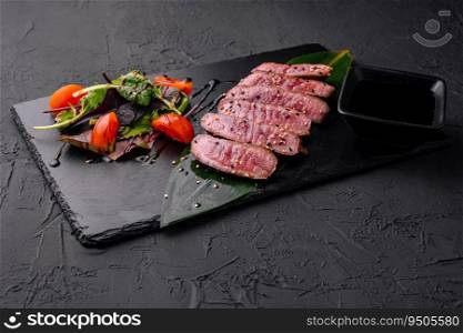 Sliced medium rare roasted beef meat pieces