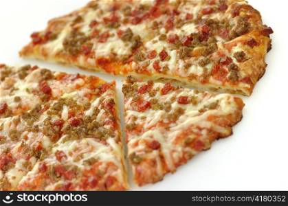 sliced mini pizza topped with sausage and pepperoni
