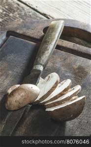 Sliced mushrooms on wooden table