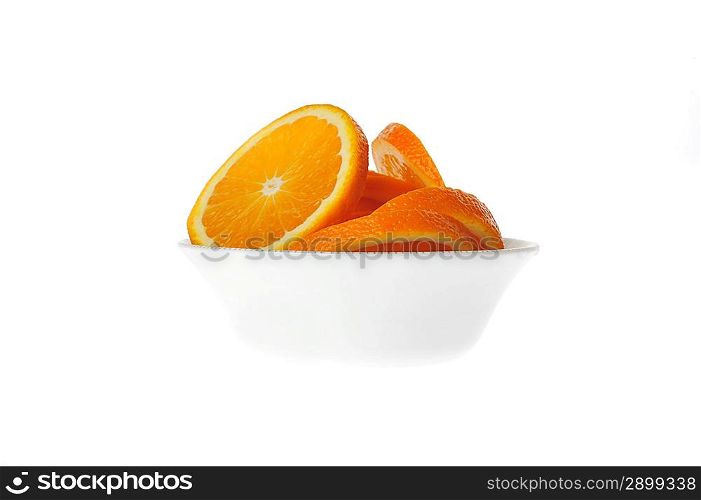sliced orange in bowl isolated on white