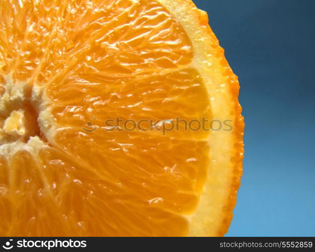 sliced orange macro with blue background