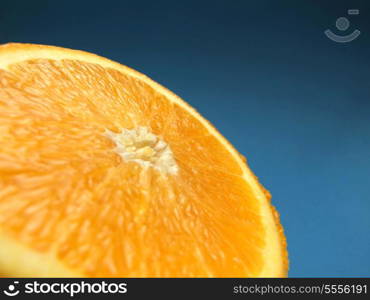 sliced orange macro with blue background