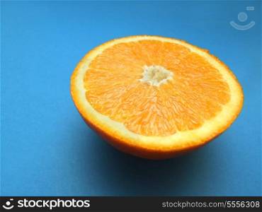 sliced orange macro with blue background
