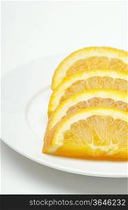 Sliced orange on plate, close-up