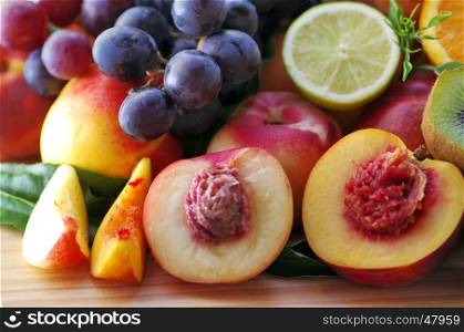 Sliced peaches, grapes, kiwi and citrus fruits