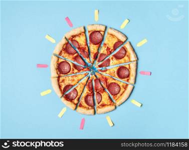 Sliced pizza salami and empty post-it for every portion, on retro blue background. Overhead with pepperoni pizza in slices. Fast food. Delicious pizza