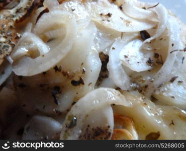 sliced potatoes and onion on a plate