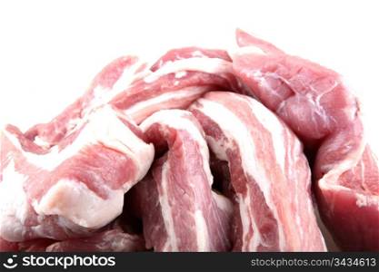 Sliced raw meat isolated on white.