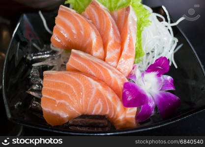 Sliced Salmon Sashimi Served On Black Plate, stock photo