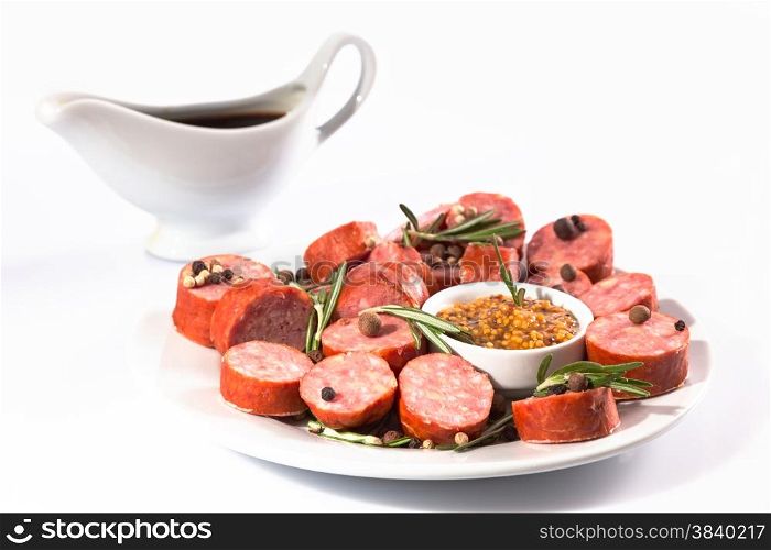 sliced sausage on a white plate
