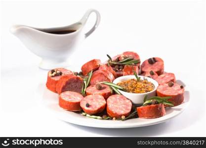 sliced sausage on a white plate