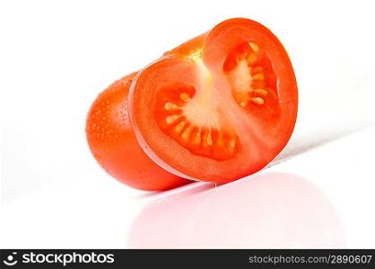 sliced tomato close up on white