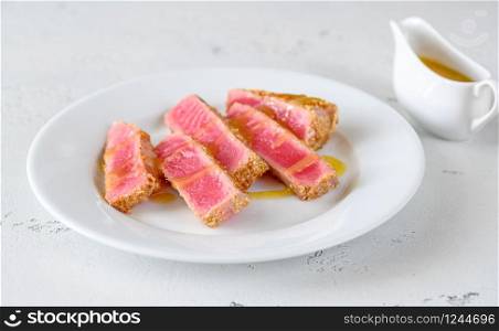 Sliced tuna steak with sesame seeds