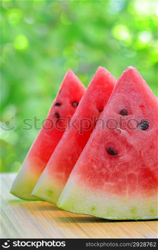 Sliced watermelon on a plate in nature