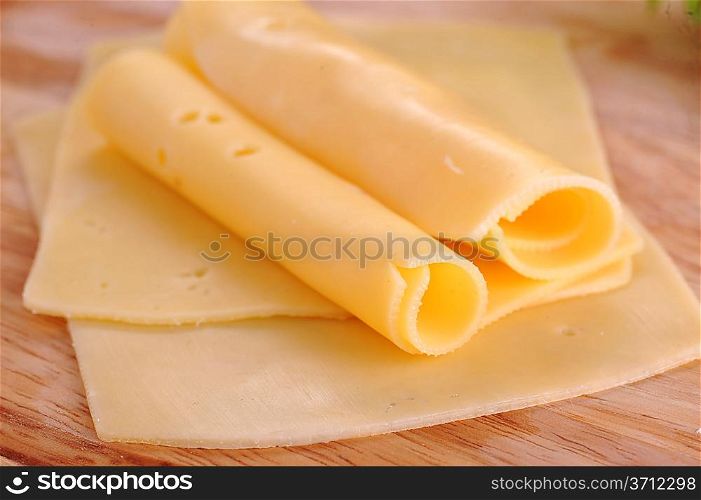 sliced yellow cheese close up