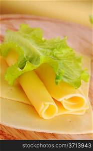 sliced yellow cheese close up
