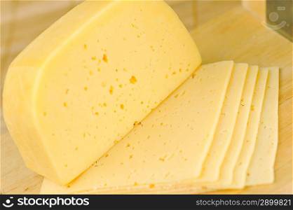 sliced yellow tasty cheese close up