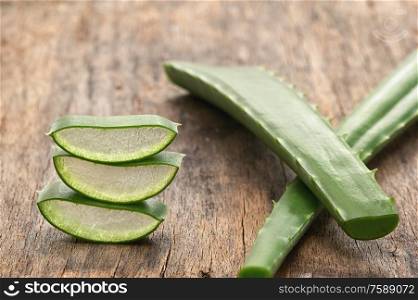 Slices Of Aloe Vera Leaves on Wooden Table