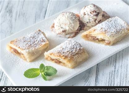 Slices of apple strudel on the white plate