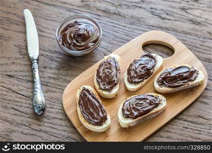 Slices of baguette with chocolate cream