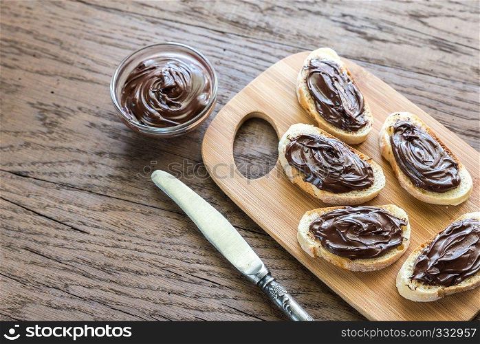 Slices of baguette with chocolate cream