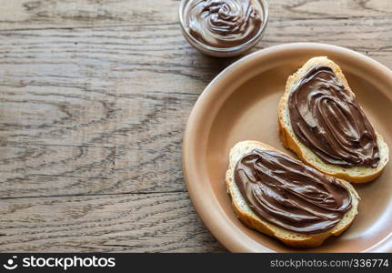 Slices of baguette with chocolate cream