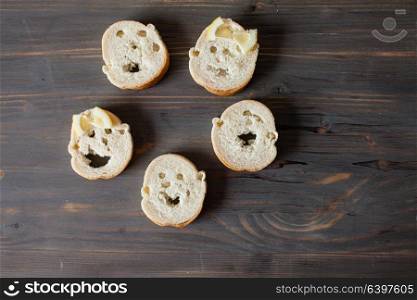 Slices of bread with different facial expression, happy family. Faces from bread
