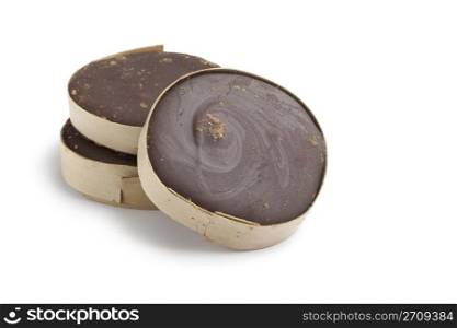 Slices of brown Palm sugar in bamboo on white background