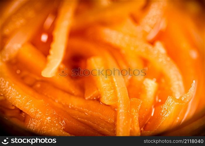 Slices of canned carrots. Macro background. Carrot texture. High quality photo. Slices of canned carrots. Macro background.