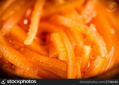 Slices of canned carrots. Macro background. Carrot texture. High quality photo. Slices of canned carrots. Macro background.