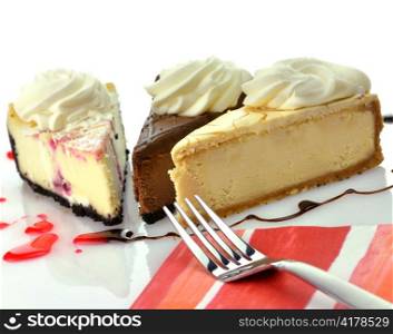 slices of cheesecakes with fork and napkin