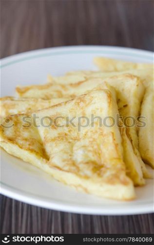 slices of french toast with on a white plate
