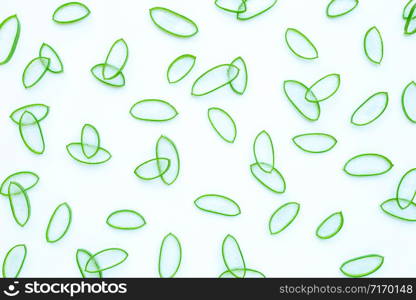 Slices of fresh aloe vera leaves on white background.