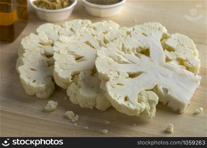 Slices of fresh raw cauliflower ready to cook